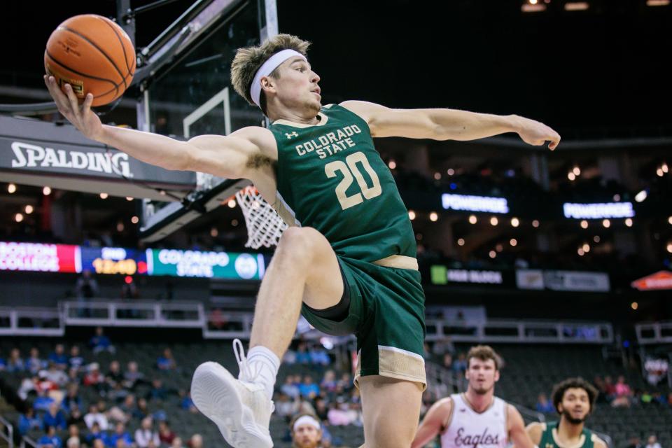 Nov 22, 2023; Kansas City, Missouri, USA; Colorado State Rams guard Joe Palmer (20) makes a leaping save during the second half against the Boston College Eagles at T-Mobile Center. Mandatory Credit: William Purnell-USA TODAY Sports