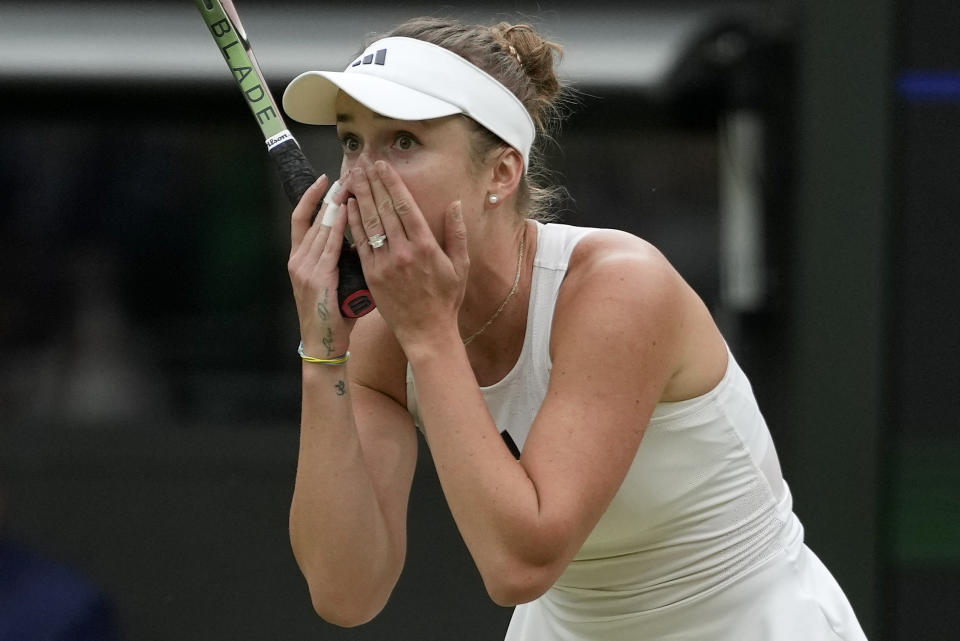 Ukraine's Elina Svitolina celebrates after beating Poland's Iga Swiatek to win their women's singles match on day nine of the Wimbledon tennis championships in London, Tuesday, July 11, 2023. (AP Photo/Kirsty Wigglesworth)