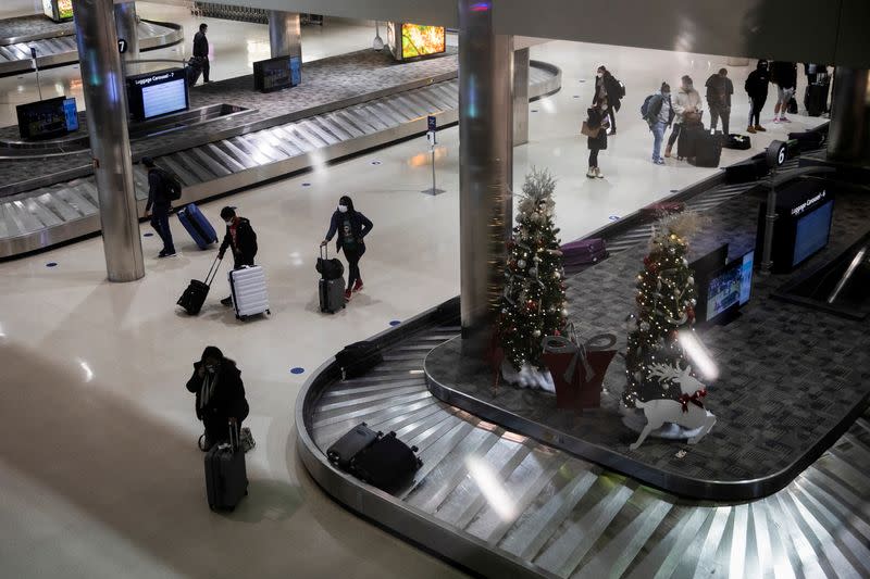 FILE PHOTO: People travel during the holiday season at Detroit Metropolitan Wayne County Airport