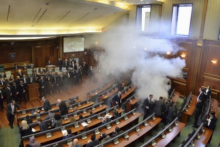 Opposition politicians release tear gas in parliament to obstruct a session in Pristina, Kosovo February 19, 2016. REUTERS/Agron Beqiri