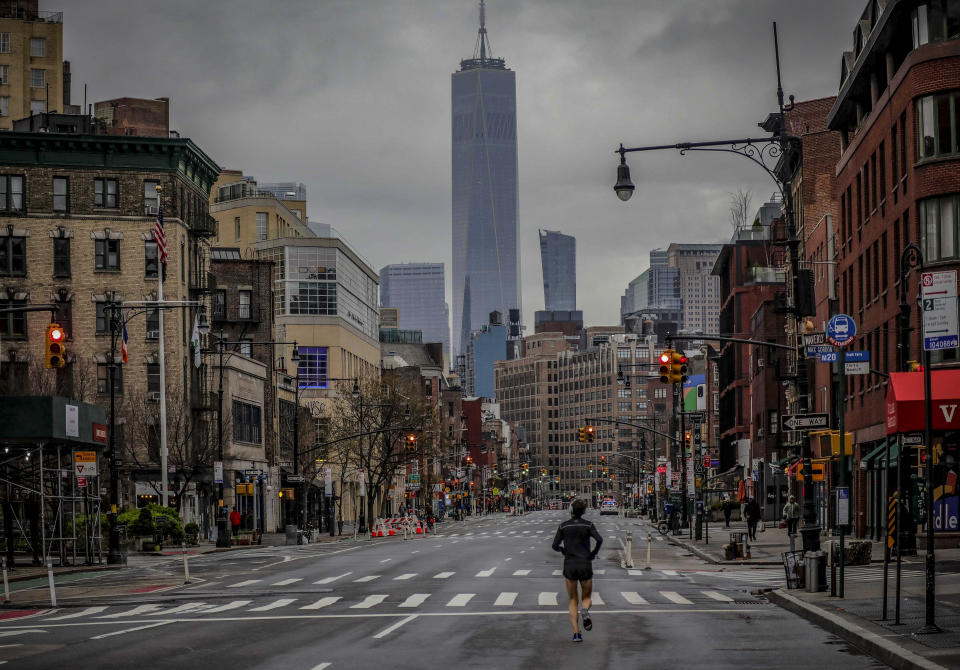 This photo from Saturday March 28, 2020, shows a lone jogger on a deserted Manhattan street after citywide after COVID-19 pandemic restrictions in New York. The chaos unleashed in 2020, amid the coronavirus pandemic, has created space for different voices to speak, for different conversations to be had and for different questions to be asked. (AP Photo/Bebeto Matthews, File)