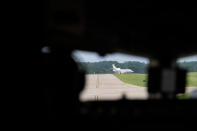 A jet sits on a runway creating a hazard, seen from a Boeing 757 test aircraft cockpit demonstrating runway hazard warning systems, at the airport in Tyler, Texas, Tuesday, June 4, 2024. (AP Photo/LM Otero)
