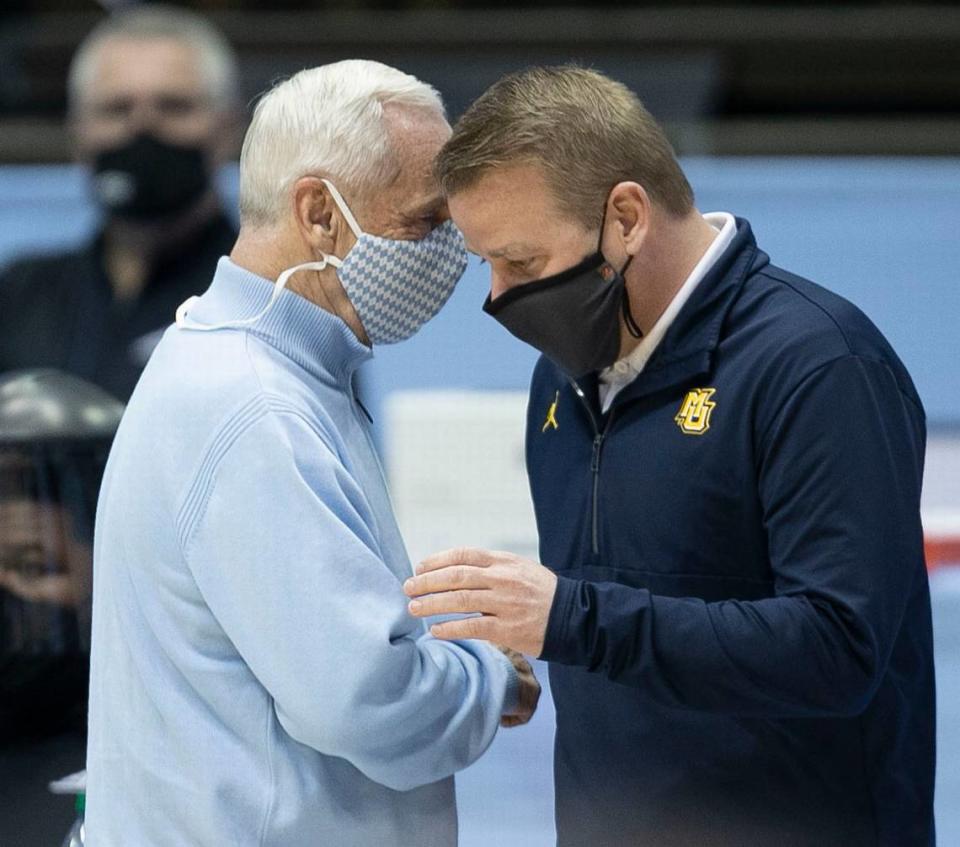 North Carolina coach Roy Williams greets Marquette coach Steve Wojciechowski prior to their game on Wednesday, February 24, 2021 at the Smith Center in Chapel Hill, N.C.