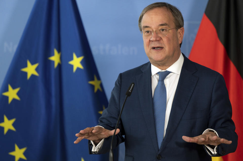 FILE-In this Sept. 2, 2021 file photo Armin Laschet, Minister President of North Rhine-Westphalia gives a press conference after the hydrogen summit in Duesseldorf, Germany. The center-right Union bloc's candidate to succeed Angela Merkel as chancellor in this month's German election announced eight experts Friday to advise him on how to tackle issues such as climate change and education, as he struggles to reverse a sustained downward trend in the polls. (Federico Gambarini/dpa via AP)