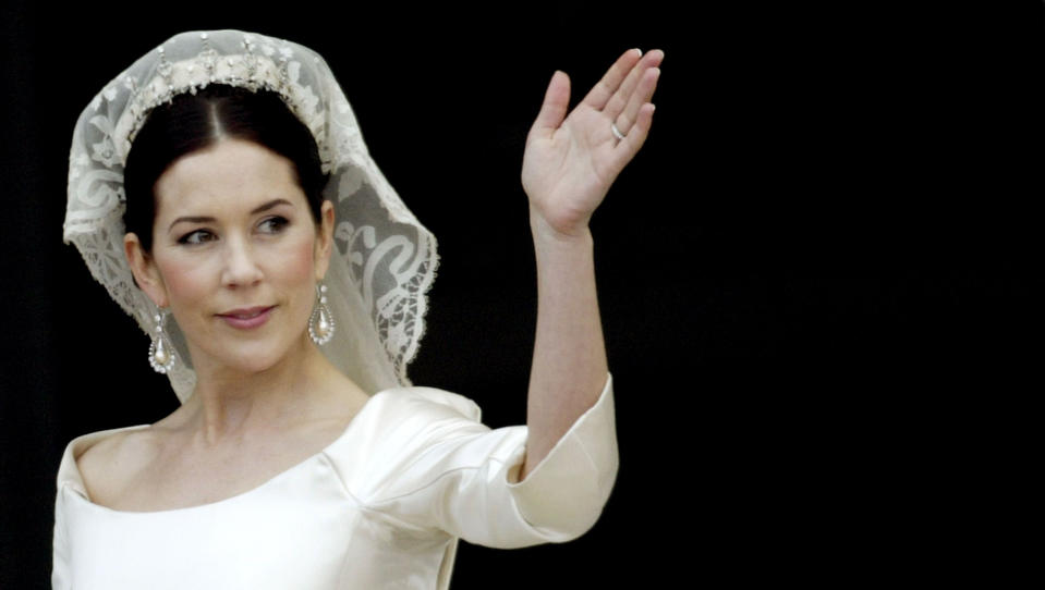 Crown Princess Mary waves from the balcony of Christian VII's Palace after her wedding