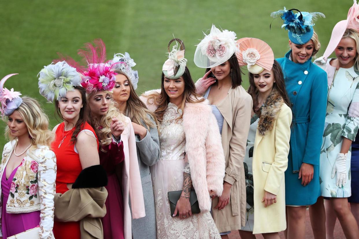 Racegoers queue to enter the course during Ladies Day of the 2018 Cheltenham Festival at Cheltenham Racecourse: PA