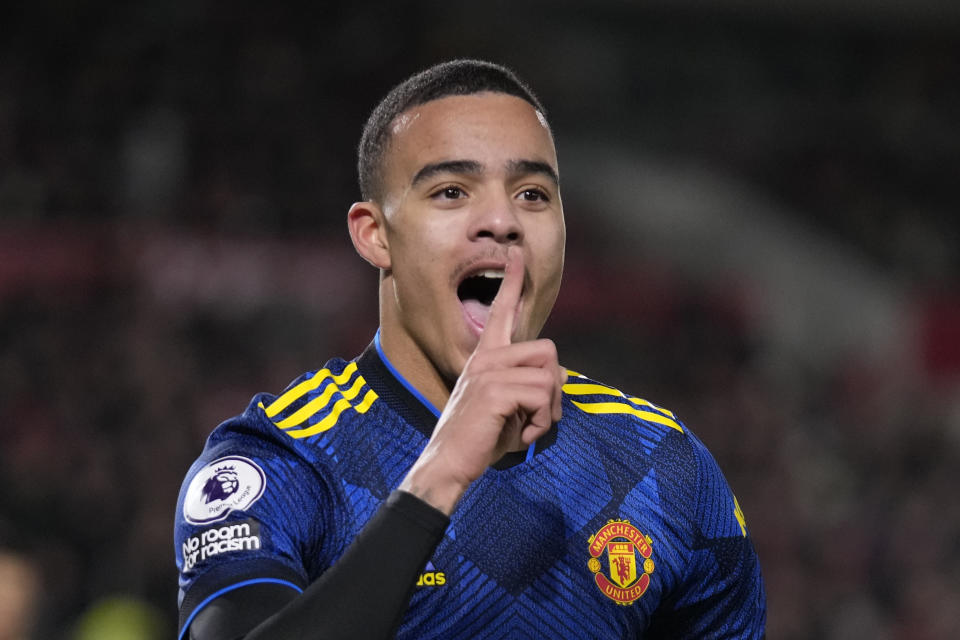 Manchester United's Mason Greenwood celebrates after scoring his side's second goal during an English Premier League soccer match between Brentford and Manchester United at the Brentford Community Stadium in London, Wednesday, Jan. 19, 2022. (AP Photo/Matt Dunham)