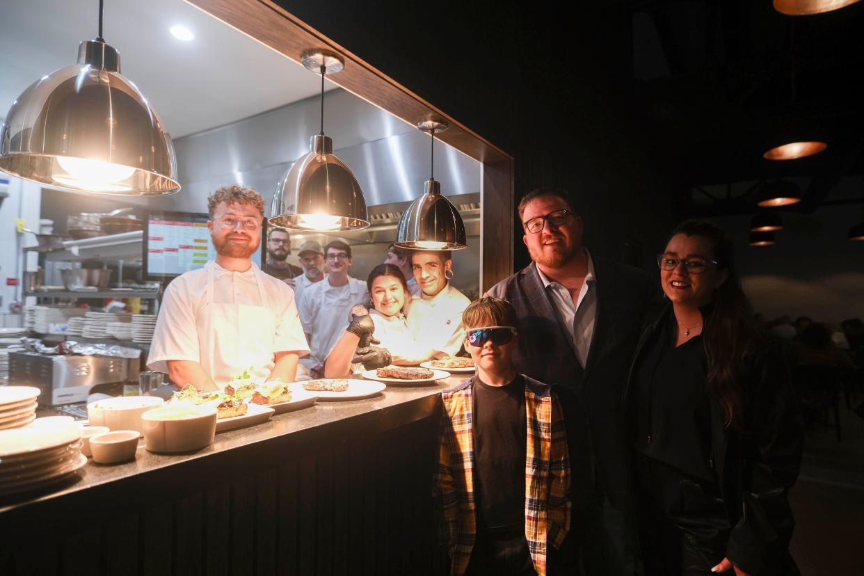Owner Gabe Howard, his wife Rachael and son Jaxx, one of their four children, stand alongside kitchen staff at Prime & Pint in Columbia, Tenn. on April 19, 2024. (From left) Staff includes Travis Trent Chef Jon Newman, Brent Pendleton, Jared Elliott, and Chef Paul Sellas and his daughter Yanna Sellas, who serves as pastry chef.