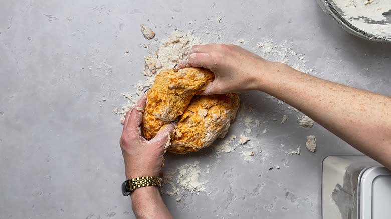 kneading dough on table