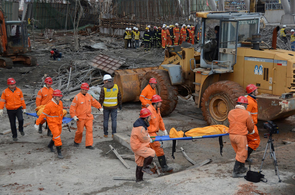 Rescue workers carry out a victim