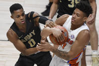 Army's Josh Caldwell, left, and Florida's Keyontae Johnson fight for possession of the ball in the second half of an NCAA college basketball game, Wednesday, Dec. 2, 2020, in Uncasville, Conn. (AP Photo/Jessica Hill)