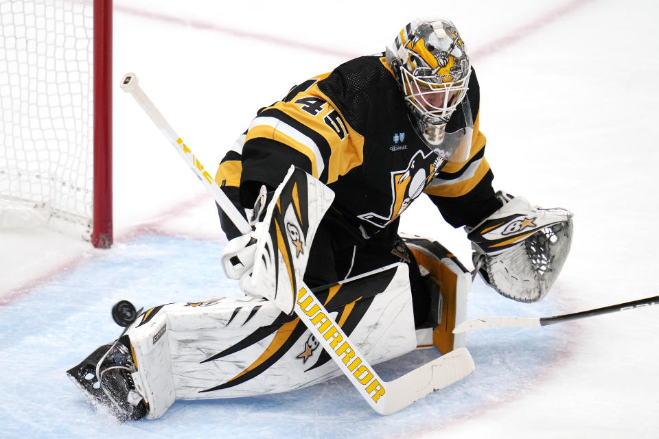 A shot by Ottawa Senators' Drake Batherson (not shown) gets past Pittsburgh Penguins goaltender Magnus Hellberg for a goal during the third period of an NHL hockey game in Pittsburgh, Saturday, Oct. 28, 2023. (AP Photo/Gene J. Puskar)