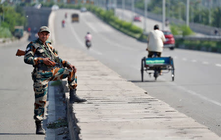 Soldiers patrol the streets in Panchkula, India August 26, 2017. REUTERS/Cathal McNaughton