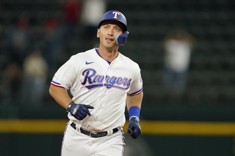 Texas Rangers' Mark Mathias runs the bases after hitting a game-ending home run in the ninth inning of the team's 8-7 win in a baseball game against the Oakland Athletics in Arlington, Texas, Tuesday, Sept. 13, 2022. (AP Photo/Tony Gutierrez)