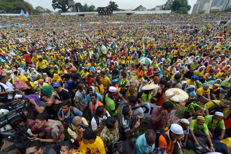 Thousands of protesters gather at Stadium Merdeka during a rally for electorial reforms, in Kuala Lumpur, on January 12, 2013. Followers of the three-party alliance led by opposition firebrand Anwar Ibrahim streamed through the capital to converge on the iconic stadium where the current ruling bloc declared independence in 1957