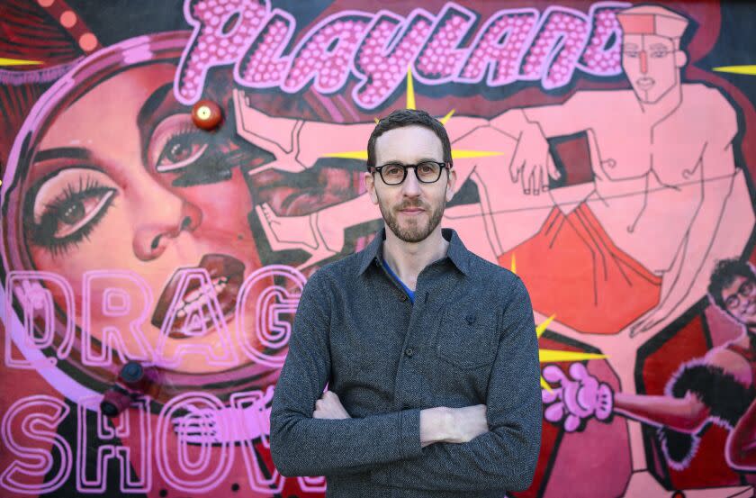 SAN FRANCISCO, CA - MARCH 05, 2023 - Senator Scott Wiener stands in front of a mural at Oasis, a drag show he helped the owners launch in San Francisco, California on March 05, 2023. (Josh Edelson/For The Times)