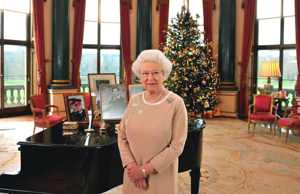 FILE - In this Monday, Dec. 22, 2008 file photo, Britain's Queen Elizabeth II stands in the Music Room of Buckingham Palace after recording her Christmas Day message to the Commonwealth. Queen Elizabeth II, Britain’s longest-reigning monarch and a rock of stability across much of a turbulent century, has died. She was 96. Buckingham Palace made the announcement in a statement on Thursday Sept. 8, 2022. (John Stillwell, Pool Photo via AP, File)
