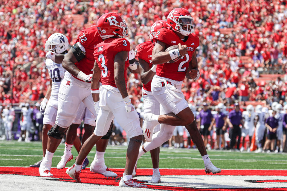 Sep 3, 2023; Piscataway, New Jersey, USA; Rutgers Scarlet Knights quarterback Gavin Wimsatt (2) celebrates his touchdown with teammates during the first half against the Northwestern Wildcats at SHI Stadium. Mandatory Credit: Vincent Carchietta-USA TODAY Sports