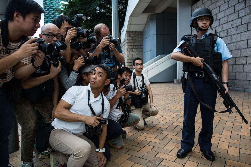 The press reacts as Rurik Jutting leaves court in Hong Kong