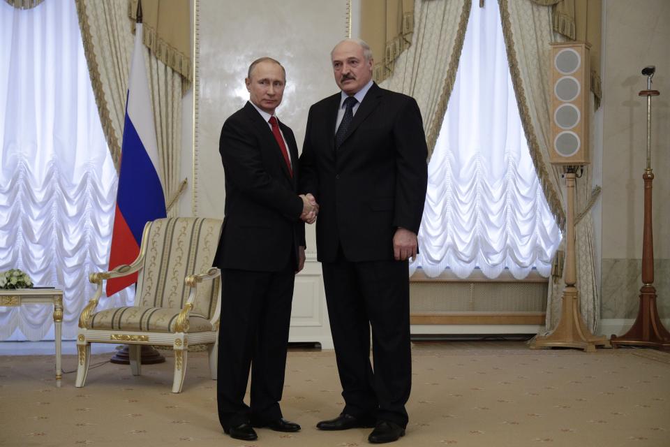 Russian President Vladimir Putin, left, and Belarus' President Alexander Lukashenko shake hands during their meeting at Konstantin palace in St.Petersburg, Russia, Monday, April 3, 2017. Following an explosion on the subway in St. Petersburg, Putin, who was visiting the city on an unrelated trip Monday, said investigators are looking into whether the explosion was a terror attack. (AP Photo/Dmitri Lovetsky, pool)