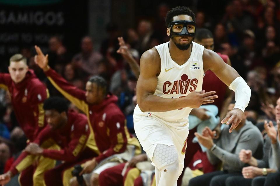 Mar 29, 2024; Cleveland, Ohio, USA; Cleveland Cavaliers guard Donovan Mitchell (45) celebrates after hitting a three point basket during the first half against the Philadelphia 76ers at Rocket Mortgage FieldHouse. Mandatory Credit: Ken Blaze-USA TODAY Sports