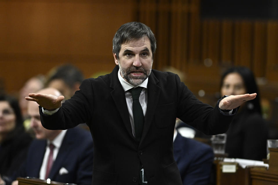 Minister of Environment and Climate Change Steven Guilbeault rises during Question Period in the House of Commons on Parliament Hill in Ottawa on Tuesday, Nov. 28, 2023.  Guilbeault says two recent court decisions striking down some federal environment policies delayed plans to implement a cap on emissions from oil and gas production.THE CANADIAN PRESS/Justin Tang