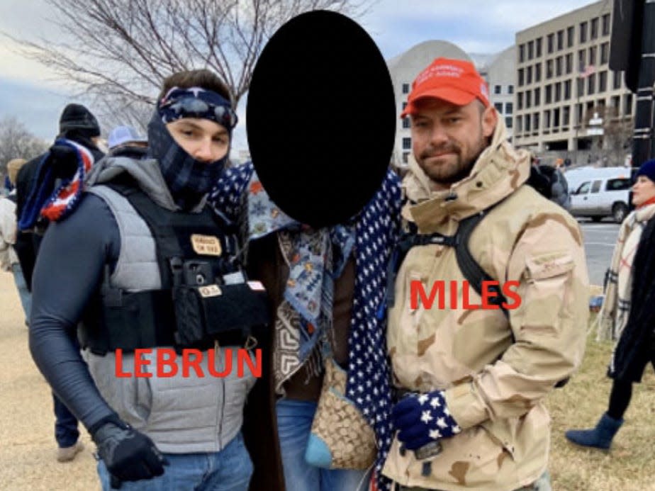 An anonymous witness poses for a photo with Miles and Lebrum.