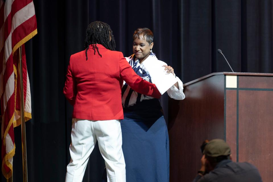 Battle Creek Public Schools Superintendent Kimberly Clark greets W.K. Kellogg Foundation President and CEO La June Montgomery Tabron during a ceremony announcing the Bearcat Advantage scholarship Wednesday, May 17, 2023 at W.K. Kellogg Auditorium.