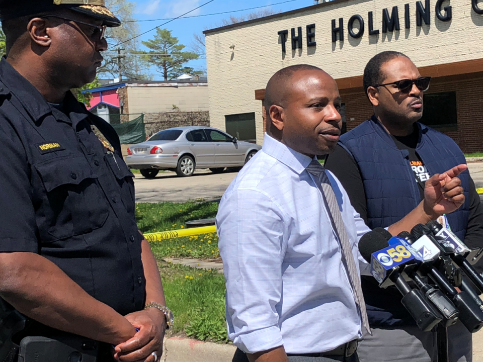 Mayor Cavalier Johnson, middle, Police Chief Jeffrey Norman, left, and Office of Community Wellness and Safety Director Ashanti Hamilton address the media at the scene of a crash where a 4-year-old died and her mother was injured in a hit-and-run on Tuesday.