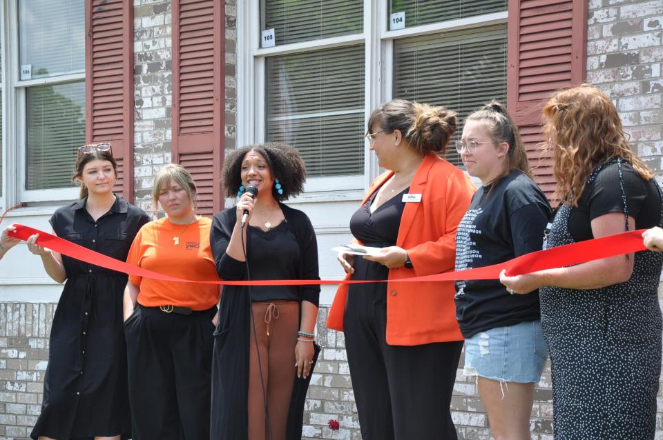 Caitie Scott, president of the Alliance YWCA board, welcomes guests to the opening event for the nonprofit's new South Union Avenue shelter for families and women on June 14, 2024, in Alliance.