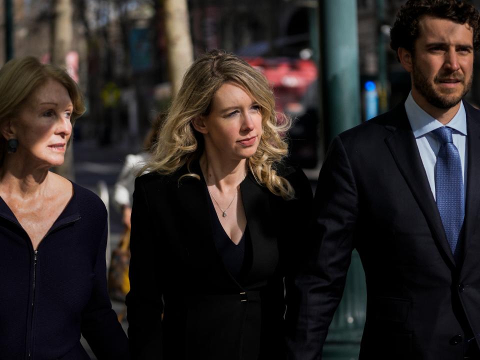 Elizabeth Holmes with her mother, Noel Holmes, and boyfriend, Billy Evans, in 2023.