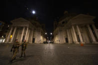 A view of Milan's Via del Corso from Piazza del Popolo with some soldiers in the evening before the entire nation of Italy has been placed under lockdown. (Credit: Giuseppe Fama/Pacific Press/LightRocket via Getty Images)