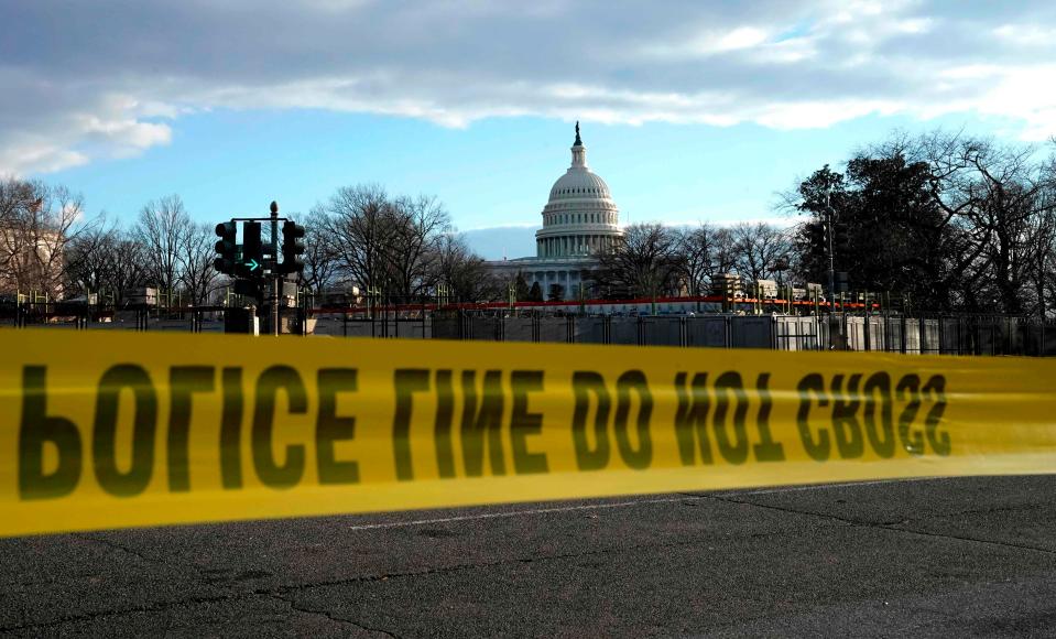 Police tape is visible as preparations for the presidential inauguration are made on Jan. 18, 2021.