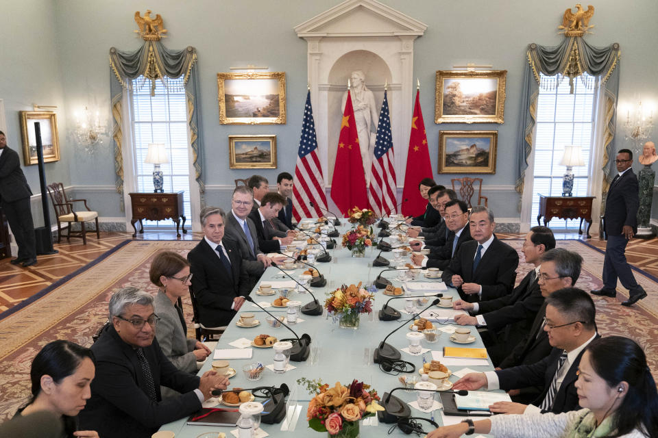 Secretary of State Antony Blinken, left, and Chinese Foreign Minister Wang Yi, right, with their delegations during a bilateral meeting at the State Department in Washington, Friday, Oct. 27, 2023. (AP Photo/Jose Luis Magana)