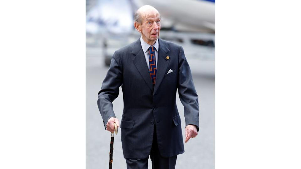 Prince Edward, Duke of Kent in a grey suit with a walking stick