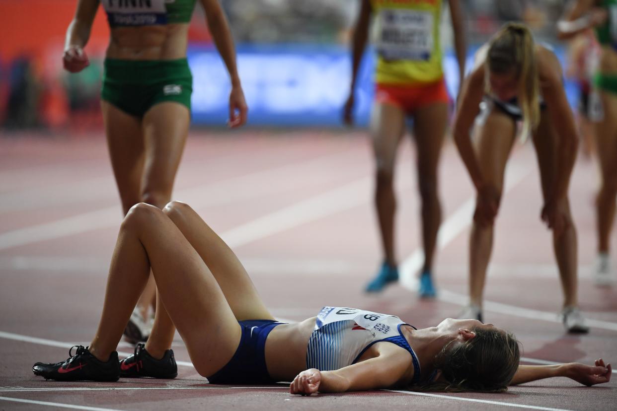 Britain's Elizabeth Bird lies on the track after competing in the Women's 3000m steeplechase heats at the 2019 IAAF World Athletics Championships at the Khalifa International stadium in Doha on September 27, 2019. (Photo by Jewel SAMAD / AFP)        (Photo credit should read JEWEL SAMAD/AFP/Getty Images)