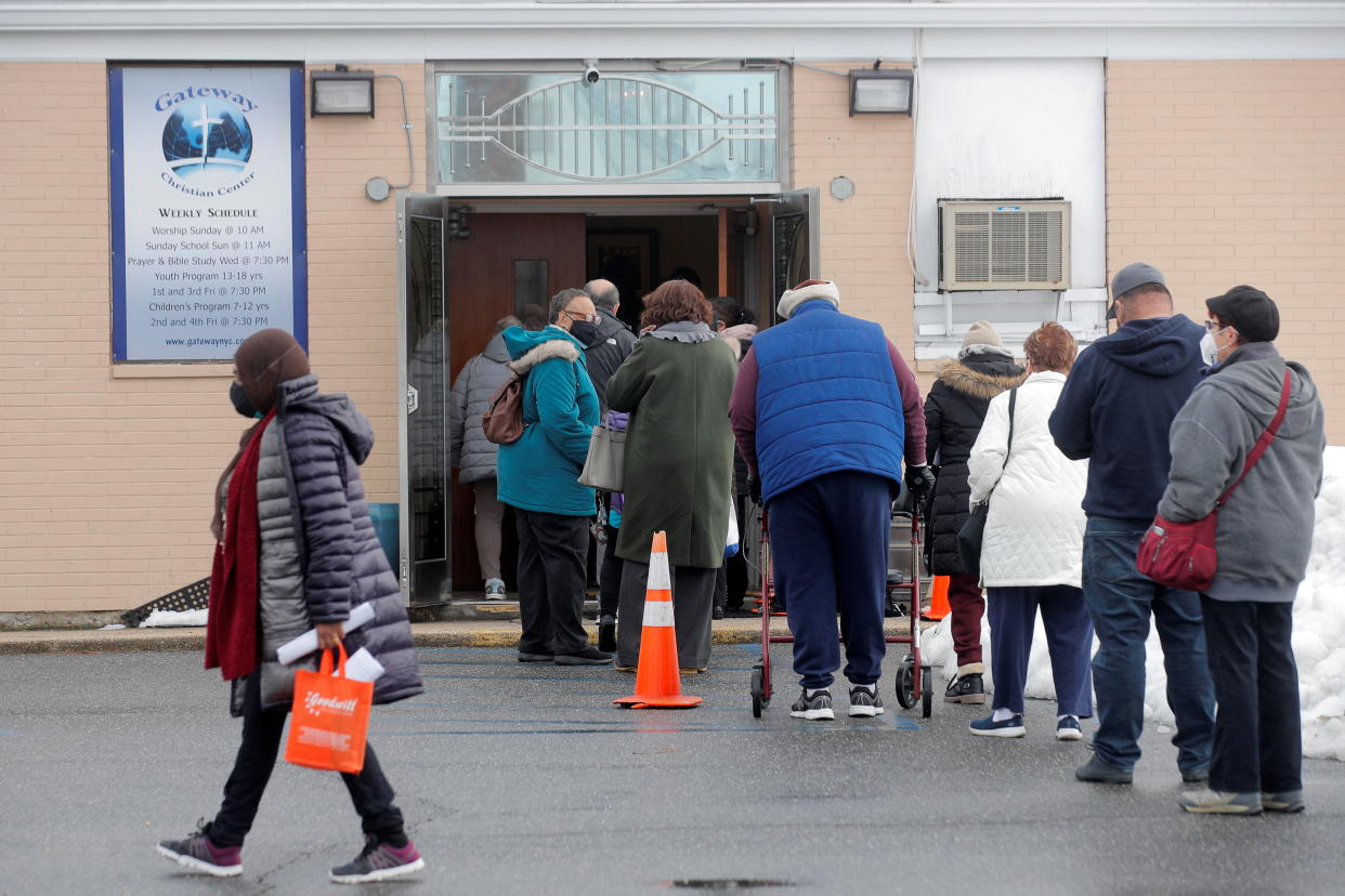 People wait in line to receive Pfizer's coronavirus disease (COVID-19) vaccine at a pop-up community vaccination center at the Gateway World Christian Center in Valley Stream, New York, U.S., February 23, 2021.  REUTERS/Brendan McDermid