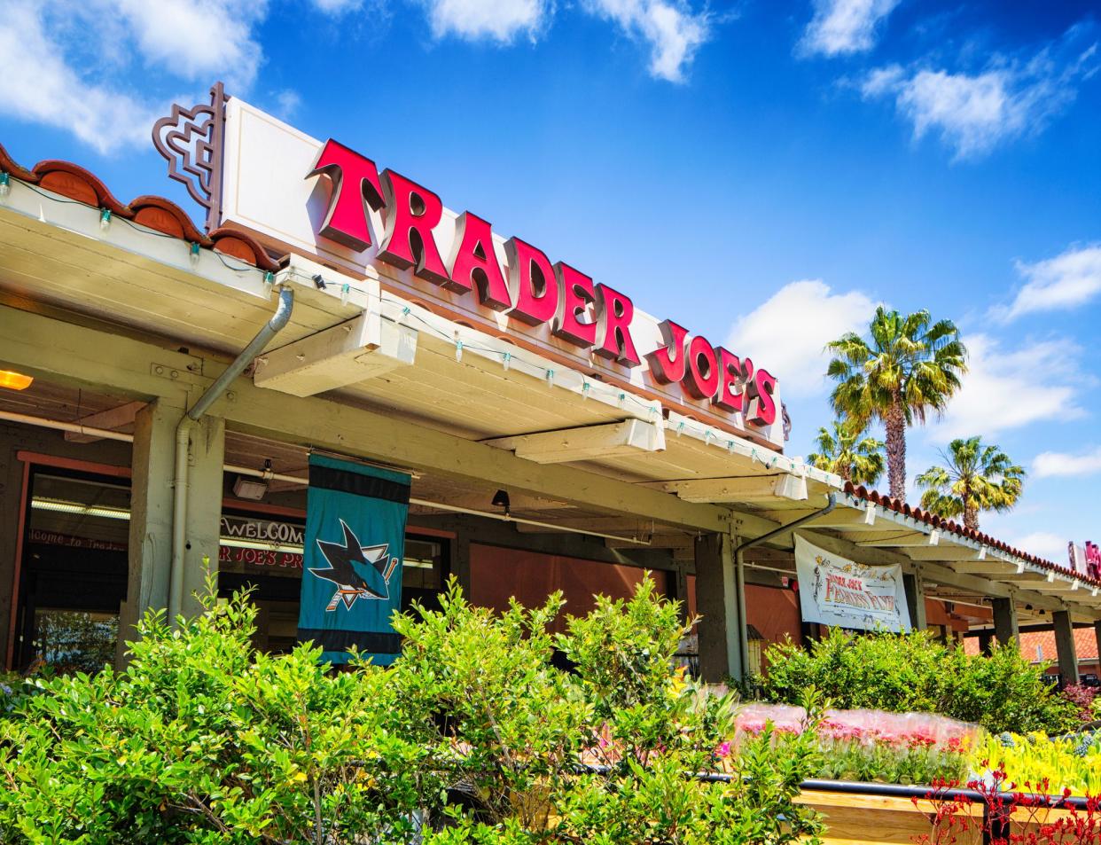 Campbell, USA - May 9, 2016: Trader Joe's grocery store in campbell California with sign above the entrance. A San Jose sharks flag is hanging to celebrate their success.