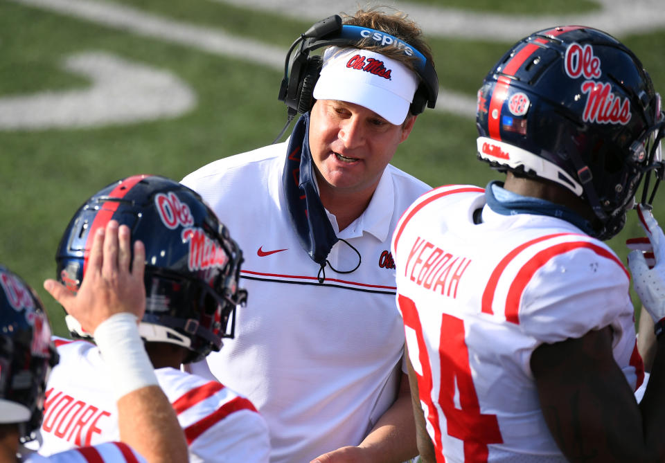 Oct 31, 2020; Nashville, Tennessee, USA; Mississippi Rebels head coach Lane Kiffin congratulates Mississippi Rebels wide receiver <a class="link " href="https://sports.yahoo.com/nfl/players/33422" data-i13n="sec:content-canvas;subsec:anchor_text;elm:context_link" data-ylk="slk:Elijah Moore;sec:content-canvas;subsec:anchor_text;elm:context_link;itc:0">Elijah Moore</a> (8) after a touchdown during the first half against the <a class="link " href="https://sports.yahoo.com/ncaaf/teams/vanderbilt/" data-i13n="sec:content-canvas;subsec:anchor_text;elm:context_link" data-ylk="slk:Vanderbilt Commodores;sec:content-canvas;subsec:anchor_text;elm:context_link;itc:0">Vanderbilt Commodores</a> at Vanderbilt Stadium. Mandatory Credit: Christopher Hanewinckel-USA TODAY Sports