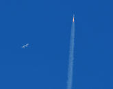 The SpaceShipTwo VSS Unity passenger craft (R) is seen after separation from Virgin Galactic rocket plane, the WhiteKnightTwo carrier airplane (L), upon taking off from Mojave Air and Space Port in Mojave, California, U.S., February 22, 2019. REUTERS/Gene Blevins