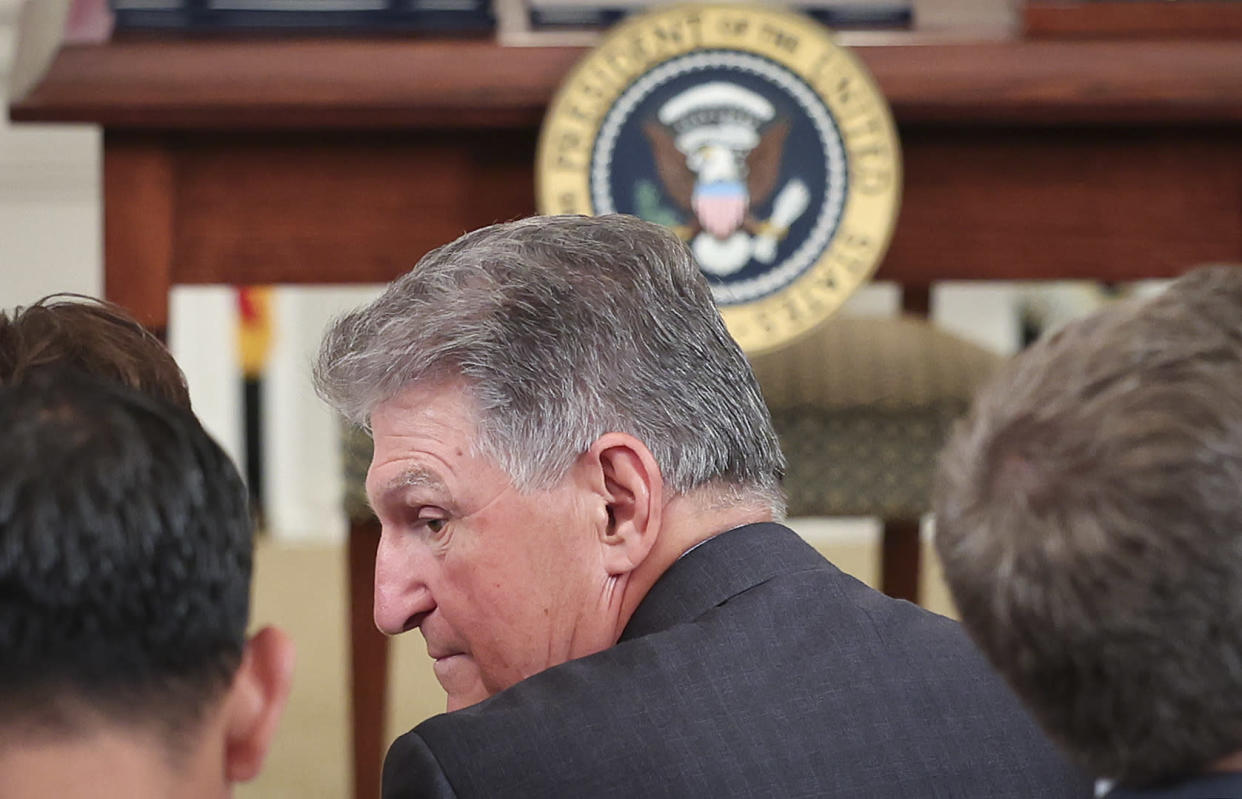 U.S. Sen. Joe Manchin (D-W.Va.) talks with guests before President Joe Biden signed nine bills into law with the goal of improving military veterans' lives on June 7, 2022, in Washington, D.C. (Win McNamee/Getty Images)