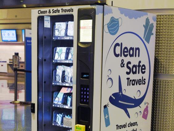 LAS VEGAS, NEVADA - MAY 14: A personal protective equipment vending machine is set up in the Terminal 1 ticketing area at McCarran International Airport on May 14, 2020 in Las Vegas, Nevada. The airport used its social media platforms on Thursday to report that it was the first to install the machines that sell items such as masks, gloves and hand sanitizer. The nation's 10th busiest airport recorded a 53% decrease in arriving and departing passengers for March compared to the same month in 2019, a drop of more than 2.3 million travelers, as the COVID-19 pandemic impacts the travel industry. (Photo by Ethan Miller/Getty Images) (Getty Images)