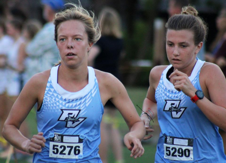 Ponte Vedra's Daisy Ross (5276) and Lindy White (5290) run during the girls elite race at the Katie Caples Invitational.