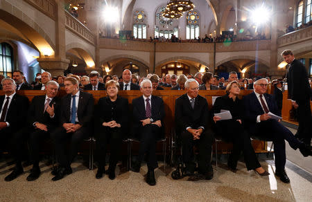 German Chancellor Angela Merkel, President Frank-Walter Steinmeier, his wife Elke Buedenbender, President of Germany's lower house of parliament Bundestag Wolfgang Schaeuble and President of the Central Council of Jews in Germany Josef Schuster take part in a ceremony to mark the 80th anniversary of Kristallnacht, also known as Night of Broken Glass, at Rykestrasse Synagogue, in Berlin, Germany, November 9, 2018. REUTERS/Fabrizio Bensch
