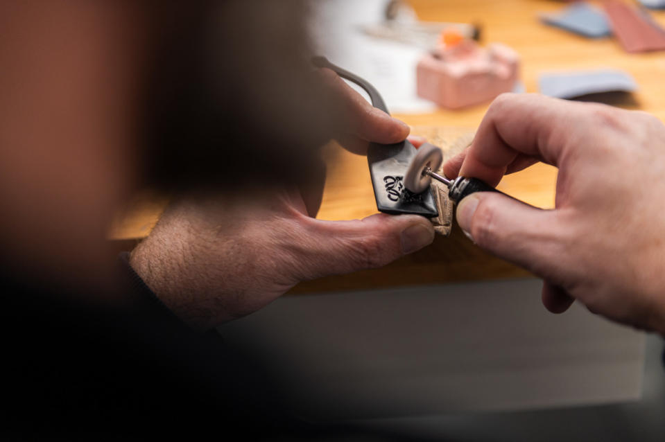 An artisan working on a pair of Loewe sunglasses.<p>Photo: Giovanni Samarini/Courtesy of Thélios</p>