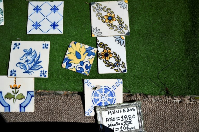 Several tiles, or azulejos, on sale at Feira da Ladra market in Lisbon