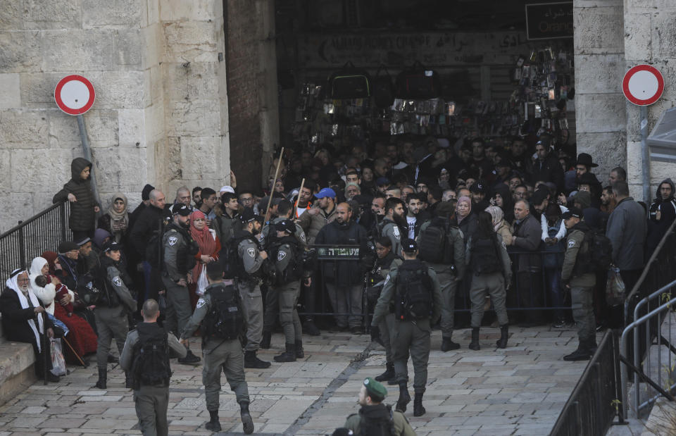 Israeli border police blocks exit of the Old City's Damascus gate ahead of a protest against Middle East peace plan announced Tuesday by US President Donald Trump, which strongly favors Israel, in Jerusalem, Wednesday, Jan 29, 2020. (AP Photo/Mahmoud Illean)