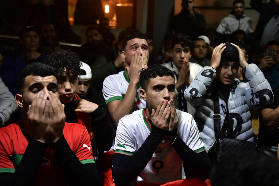 Morocco fans watch their team win the match against Spain at the World Cup soccer match tournament in Qatar, in Tudela, northern Spain, Tuesday, Dec. 6, 2022. (AP Photo/Alvaro Barrientos)