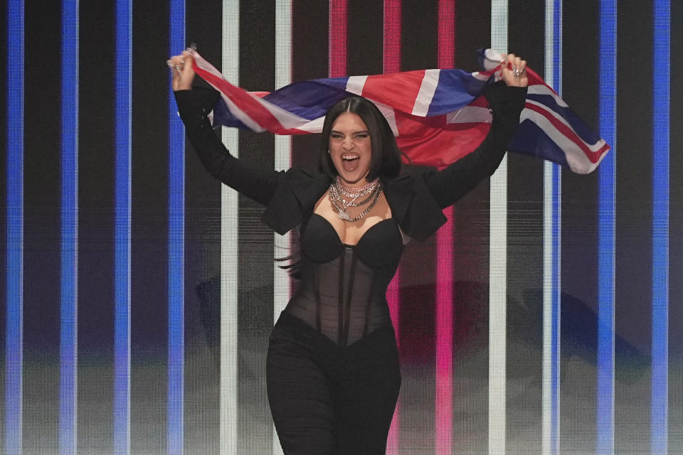 Mae Muller of the United Kingdom during the flag ceremony before during the Grand Final of the Eurovision Song Contest in Liverpool, England, Saturday, May 13, 2023. (AP Photo/Martin Meissner)