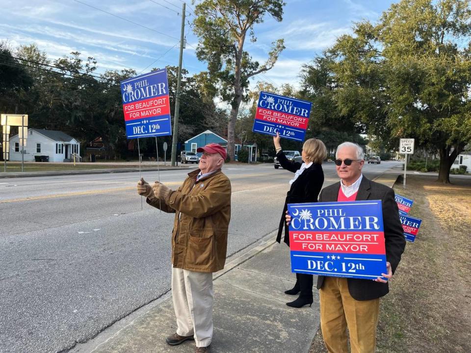 Phil Cromer, right, and his supporters campaign Tuesday afternoon along Ribaut Road near its intersection with Bay Street. Cromer ran against Mike Sutton in a special election for mayor of Beaufort. Sutton’s camp was campaigning on the other side of Ribaut Road.